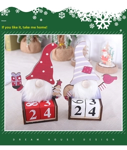 Detail of Christmas wooden gnome perpetual calendars with manual date blocks for desktop DIY
