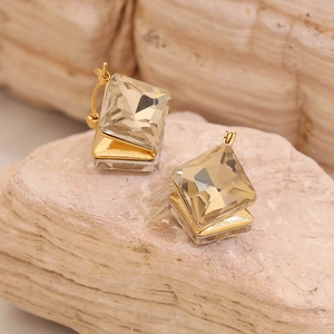 Elegant gold square crystal earrings with geometric champagne cut stones on stone