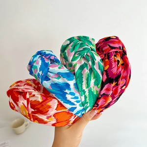 Set of four printed knotted headbands with colorful retro patterns in satin fabric
