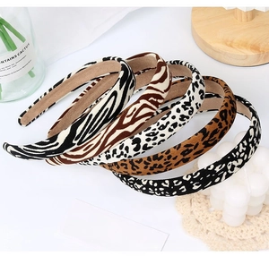 Detail of five assorted animal print sponge headbands with non-slip lining