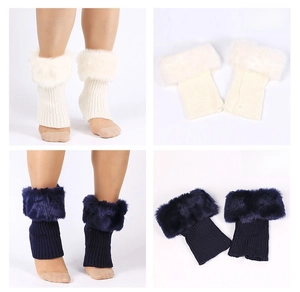 Detail of knitted leg warmers with faux fur trim in white and navy blue colors