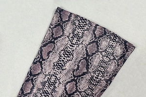Detail shot of snake print fabric showing double stitching and snakeskin texture