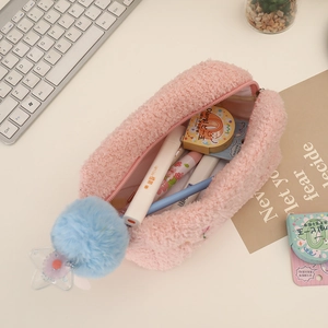 Detail of pink plush tulip pouch showing capacity for pens and star glitter charm