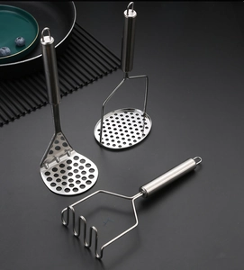 Close-up of stainless steel potato mashers with round perforated and wavy wire heads