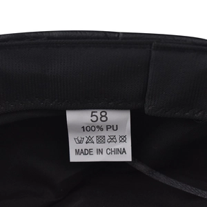 Detail view of the black PU military hat lining with a size 58 label and 100% PU material