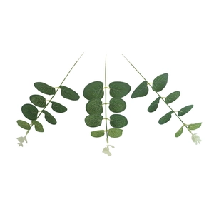 Three stems of artificial eucalyptus leaves with green matte texture on white background