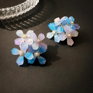 Elegant gradient blue-purple acrylic flower stud earrings with faux pearl and gold accents
