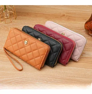 Quilted PU leather clutch bags with flower ornaments and wrist straps in four colors