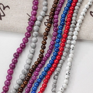 Close-up of colorful 4-12mm round stone beads in various textures for DIY jewelry making