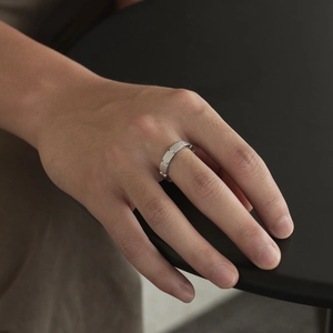 Detail of S925 sterling silver ring featuring a brushed texture and sparkling zircon inlay