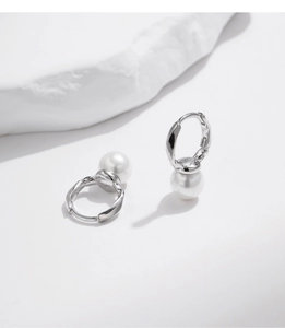 Detailed view of S925 sterling silver earrings with elegant white pearls on white background