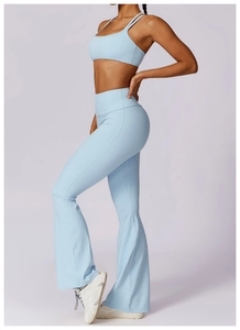 Detailed side view of light blue high-waisted flare yoga leggings and sports bra set
