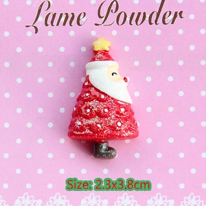Macro view of a 2.3x3.8cm red glitter Santa Claus resin accessory for DIY crafts