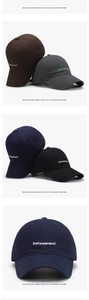 Detailed view of the betweenaod letter embroidery on a navy cotton baseball cap