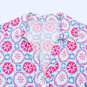 Floral print midi shirt dress in light blue with pink patterns and collar detail