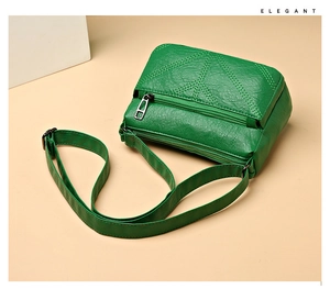 Detail view of green PU leather crossbody bag with elegant diamond quilted stitching