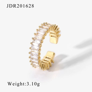 Golden vintage open ring featuring rectangular zircon stones and a polished finish
