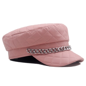 Detailed view of pink quilted PU leather newsboy hat with a silver metal chain accent