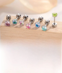 Macro shot of colorful 4mm zircon studs and titanium steel bar specifications