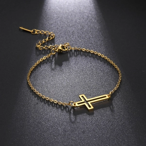 Polished gold stainless steel bracelet featuring a minimalist hollow cross pendant