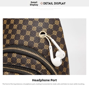 Detail of crossbody bag with clover pattern featuring a golden headphone jack and zippers