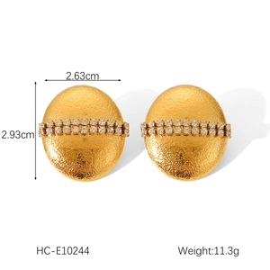 Detail view of gold textured earrings with rhinestones showing dimensions 2.63cm by 2.93cm