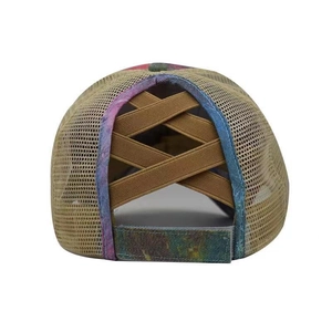 Detail of cross elastic bands and ponytail hole on a washed baseball cap for women