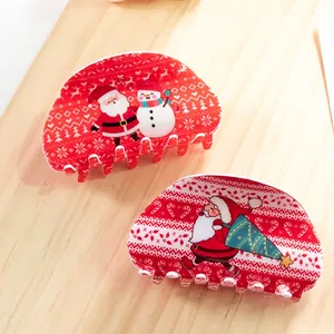 Festive red Christmas hair claws featuring Santa Claus and snowman patterns for holiday decor