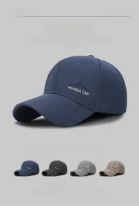 Detail showing embroidered mountain logo and multiple color options for baseball caps