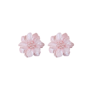 Elegant pink acrylic flower stud earrings with pearl centers on a clean white background
