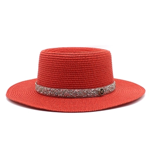 Red boater straw hat for women with rhinestone band and metallic M logo detail
