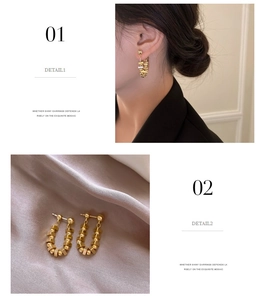 Macro detail of golden U-shaped beaded earrings on champagne satin background