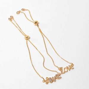 Detailed view of adjustable gold-plated Love bracelets with zircon heart charms