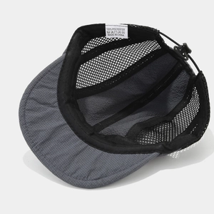 Detail of breathable mesh structure and adjustable drawstring on retro camp cap