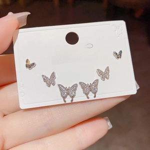 Three pairs of elegant silver butterfly stud earrings with sparkling rhinestones for women