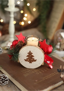 Macro detail of wooden Christmas candle holder with red star and pine on vintage books