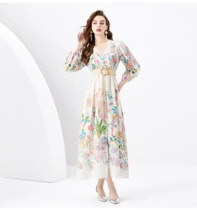Detail of V-neck floral maxi dress with pleated lantern sleeves and a straw belt