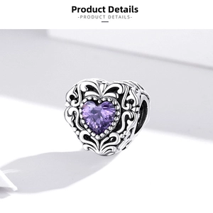 Macro shot of S925 silver heart charm with purple zircon and vintage filigree engraving