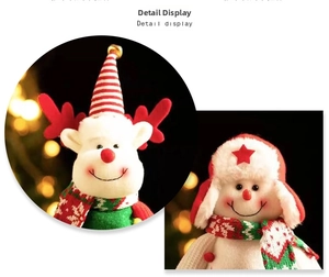 Detailed view of reindeer and snowman plush figures with festive hats and soft scarves