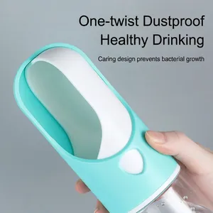 Portable pet water bottle with rotating dustproof trough in light blue for outdoor dogs