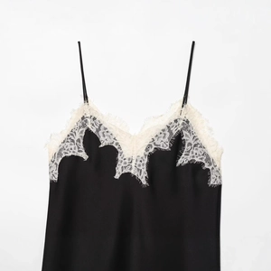 Women's black satin camisole with white eyelash lace trim and thin straps