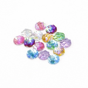 Detail shot of 6mm resin cabochons with fish scale texture and iridescent AB colorful finish