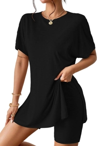 Detail shot of the black two-piece casual set showing fabric elasticity and texture