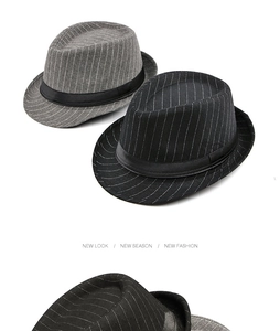 Detail view of black and grey striped wool fedora hats with elegant satin bands