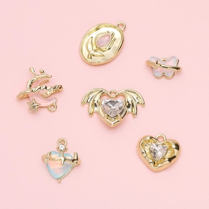 Golden DIY alloy pendants with lavender glass inlay in heart and butterfly shapes