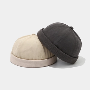 Retro brimless docker cap in beige and grey canvas with knitted cuff and adjustable strap