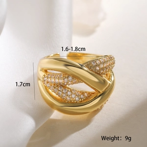 Detail showing golden criss-cross ring with zircon inlay and measurement parameters