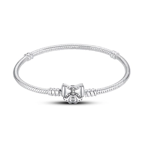 Detail of silver snake chain bracelet featuring a sparkling crystal butterfly clasp