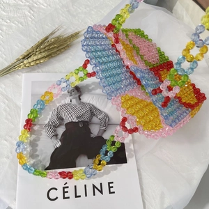 Detailed view of colorful acrylic beaded tote bag with a matching woven shoulder strap