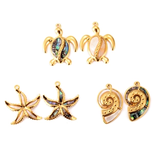Detailed view of ocean-themed gold pendants featuring sea turtle starfish and shell shapes